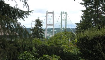 Although 150 miles from Vancouver, the new Tacoma Narrows Bridge is the pride of the State of Washington. The older span, on the right, is 57 years old, but the new one is only one week old when this picture was taken.